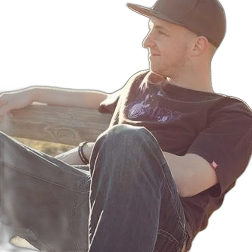 man, black, t-shirt, jeans, sits, bench, outdoors, wearing transparent PNG cut-out