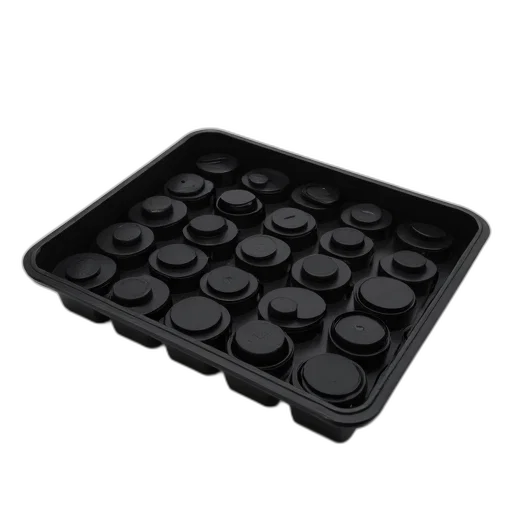 black, plastic, tray, filled, round, discs, placed, against transparent PNG cut-out