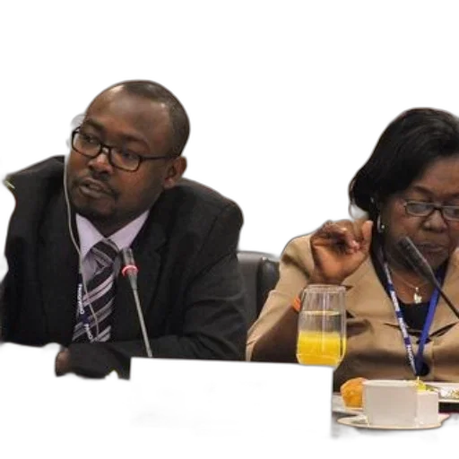 two, individuals, sit, table, labeled, haiti, one, wearing transparent PNG cut-out